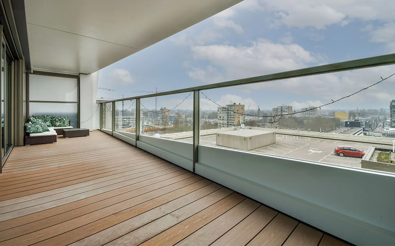 crisvisa-bioclean-spacious-balcony-with-wooden-floors-and-glass-fence-in-modern-style